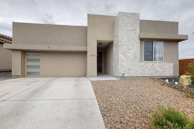 6854 Cleary Loop NE, Rio Rancho, NM 87144 - adobe home featuring concrete driveway and stucco siding