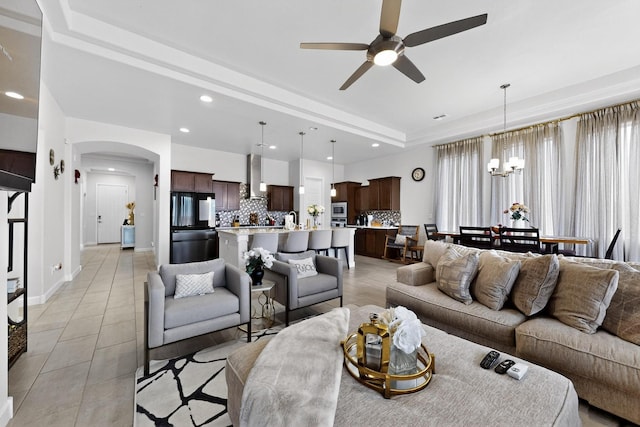 6854 Cleary Loop NE, Rio Rancho, NM 87144 - living area with a ceiling fan, arched walkways, a chandelier, healthy amount of natural light, and recessed lighting
