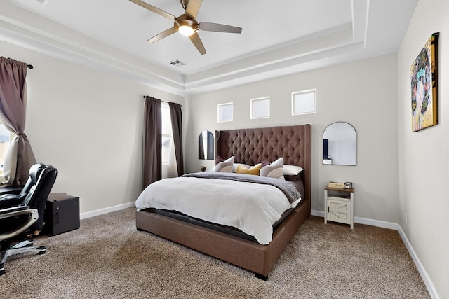 6854 Cleary Loop NE, Rio Rancho, NM 87144 - carpeted bedroom featuring a raised ceiling, multiple windows, and ceiling fan