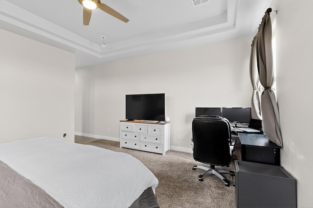 6854 Cleary Loop NE, Rio Rancho, NM 87144 - carpeted bedroom featuring a raised ceiling, an office area, and a ceiling fan