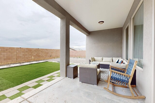 6854 Cleary Loop NE, Rio Rancho, NM 87144 - fenced backyard featuring an outdoor living space and a patio