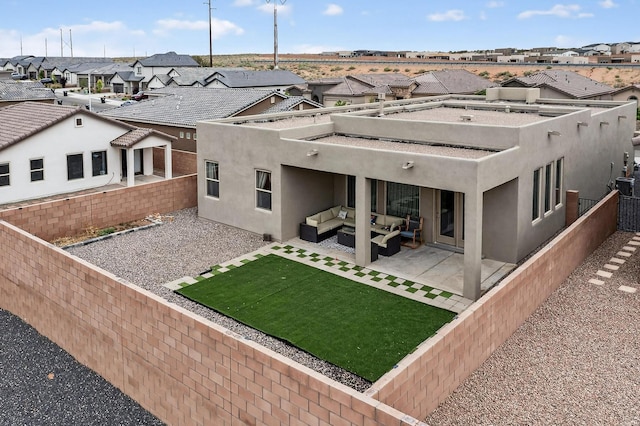 6854 Cleary Loop NE, Rio Rancho, NM 87144 - back of property featuring a residential view, an outdoor hangout area, stucco siding, a fenced backyard, and a patio