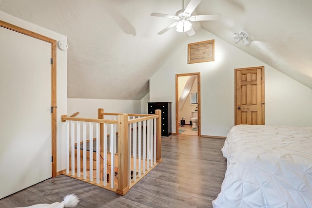 280 Ponderosa Way, Jemez Springs, NM 87025 - bedroom featuring vaulted ceiling, wood finished floors, baseboards, a ceiling fan, and ensuite bathroom