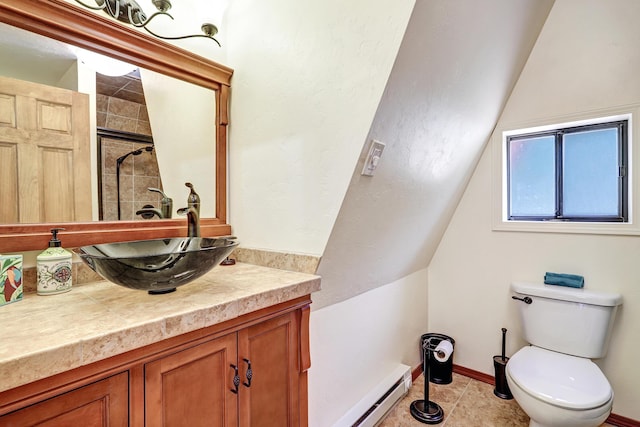 280 Ponderosa Way, Jemez Springs, NM 87025 - full bathroom with vanity, a tile shower, toilet, a baseboard heating unit, and vaulted ceiling