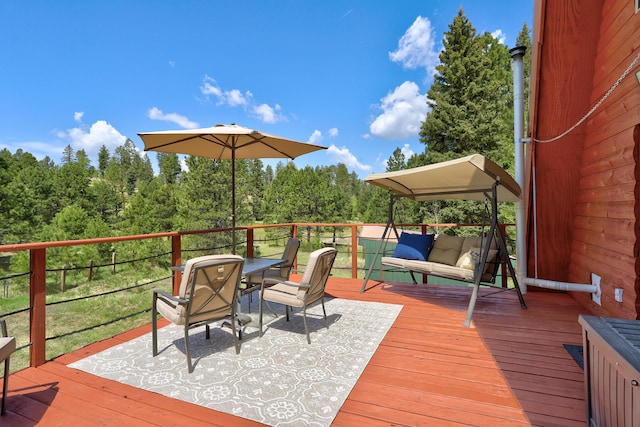 280 Ponderosa Way, Jemez Springs, NM 87025 - deck with outdoor dining area and a wooded view
