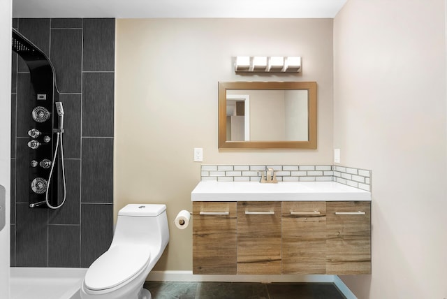 8320 Cherry Hills Dr NE, Albuquerque, NM 87111 - bathroom featuring toilet, vanity, a tile shower, backsplash, and baseboards