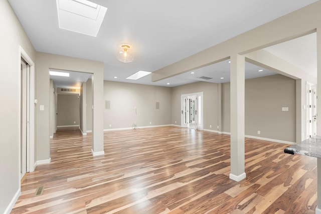 8320 Cherry Hills Dr NE, Albuquerque, NM 87111 - basement featuring light wood-style floors, baseboards, and recessed lighting