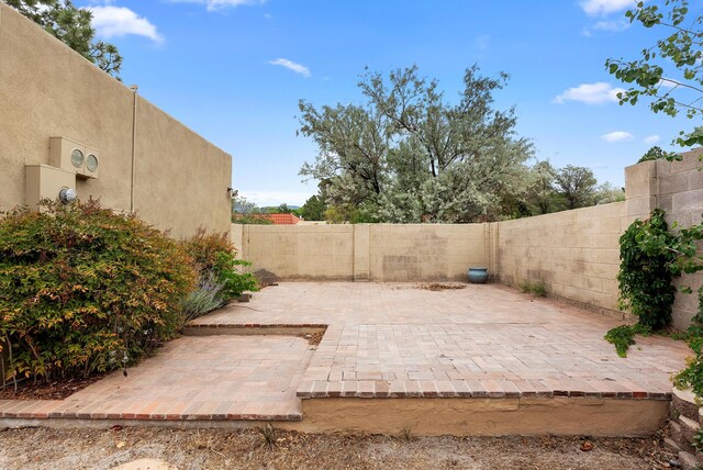 8320 Cherry Hills Dr NE, Albuquerque, NM 87111 - fenced backyard with a patio area