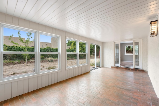 8320 Cherry Hills Dr NE, Albuquerque, NM 87111 - unfurnished sunroom featuring brick floors