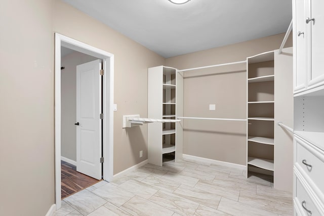 8320 Cherry Hills Dr NE, Albuquerque, NM 87111 - walk in closet with light marble finish floors