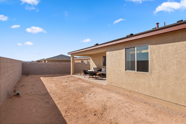 2425 Desi Loop, Belen, NM 87002 - fenced backyard featuring a patio