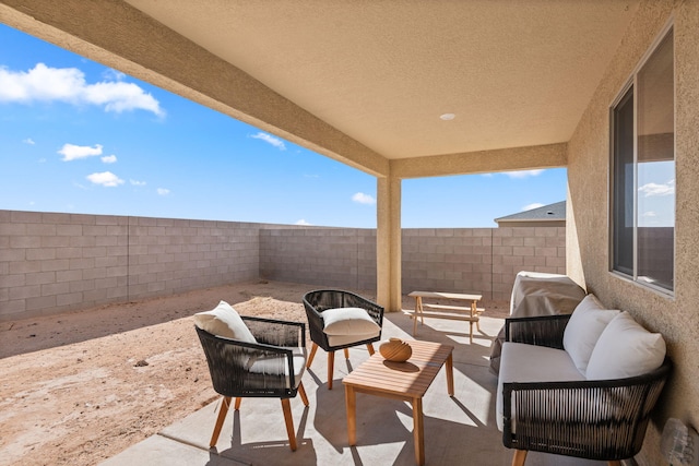 2425 Desi Loop, Belen, NM 87002 - fenced backyard with a patio area and outdoor lounge area