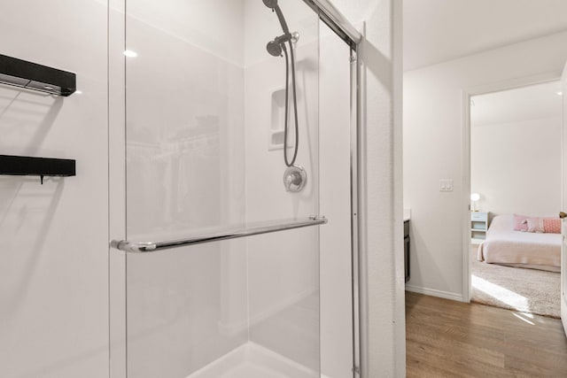 2425 Desi Loop, Belen, NM 87002 - full bath with a stall shower, wood finished floors, and baseboards