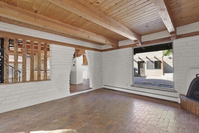 9705 Rio Grande Blvd NW, Albuquerque, NM 87114 - empty room with a baseboard heating unit, brick flooring, brick wall, and wood ceiling with exposed beams