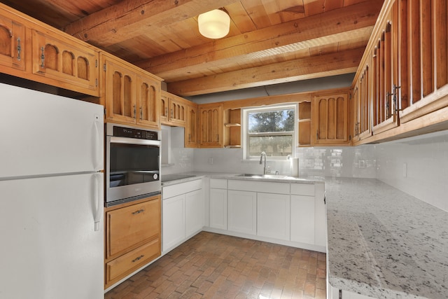 9705 Rio Grande Blvd NW, Albuquerque, NM 87114 - kitchen with freestanding refrigerator, oven, wood ceiling with exposed beams, a sink, and decorative backsplash