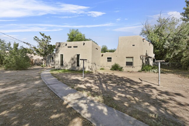 9705 Rio Grande Blvd NW, Albuquerque, NM 87114 - rear view of house with stucco siding
