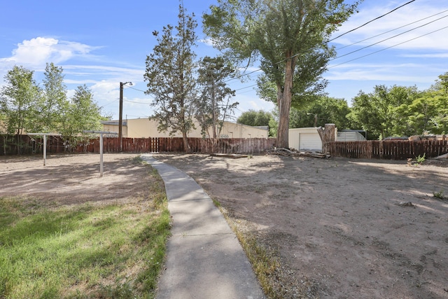 9705 Rio Grande Blvd NW, Albuquerque, NM 87114 - view of yard featuring a garage