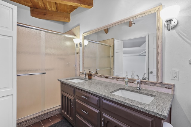 9705 Rio Grande Blvd NW, Albuquerque, NM 87114 - bathroom with double vanity, a shower stall, wood finished floors, and beamed ceiling