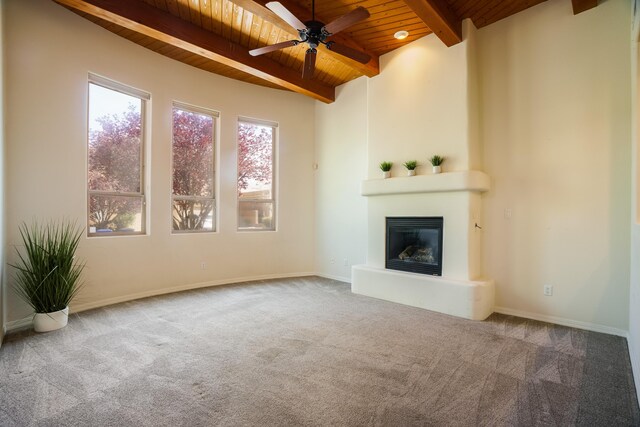 8736 Desert Fox Way NE, Albuquerque, NM 87122 - unfurnished living room featuring a wood ceiling with exposed beams, carpet floors, a fireplace, and a ceiling fan