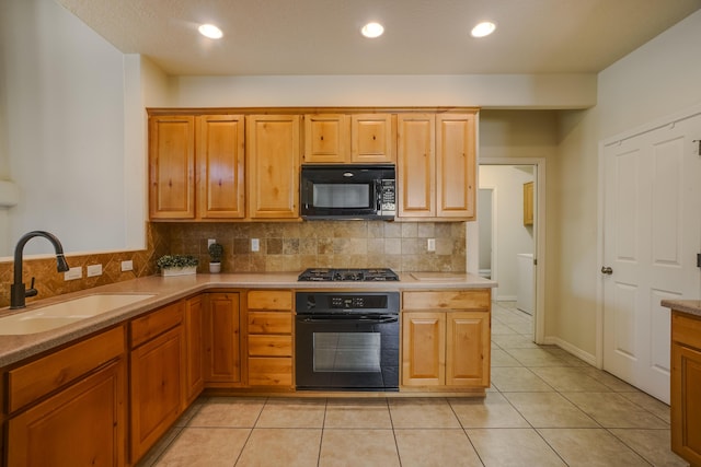 8736 Desert Fox Way NE, Albuquerque, NM 87122 - kitchen featuring black appliances, tasteful backsplash, light countertops, light tile patterned flooring, and recessed lighting