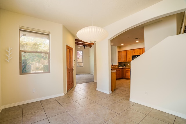 8736 Desert Fox Way NE, Albuquerque, NM 87122 - spare room featuring arched walkways, light tile patterned flooring, a ceiling fan, and recessed lighting