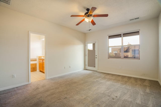 8736 Desert Fox Way NE, Albuquerque, NM 87122 - unfurnished room featuring light carpet, ceiling fan, and a textured ceiling