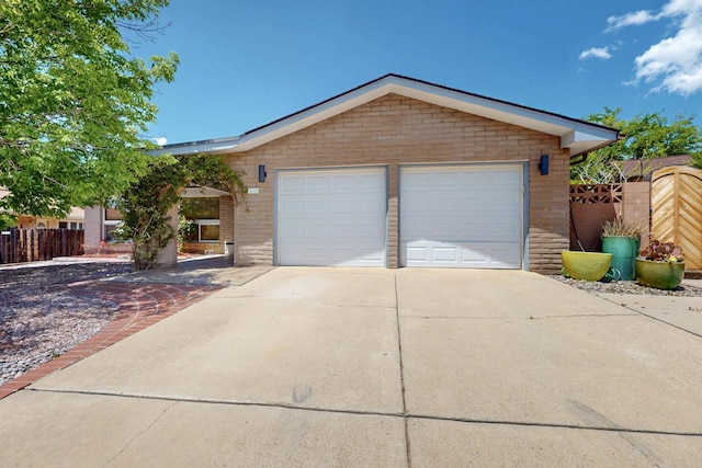 7313 Valley Forge Rd NE, Albuquerque, NM 87109 - ranch-style house featuring a garage and brick siding