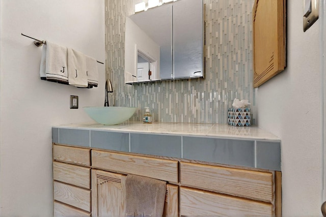 7313 Valley Forge Rd NE, Albuquerque, NM 87109 - bathroom with backsplash and vanity