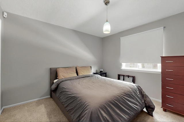 7313 Valley Forge Rd NE, Albuquerque, NM 87109 - bedroom with light carpet and baseboards