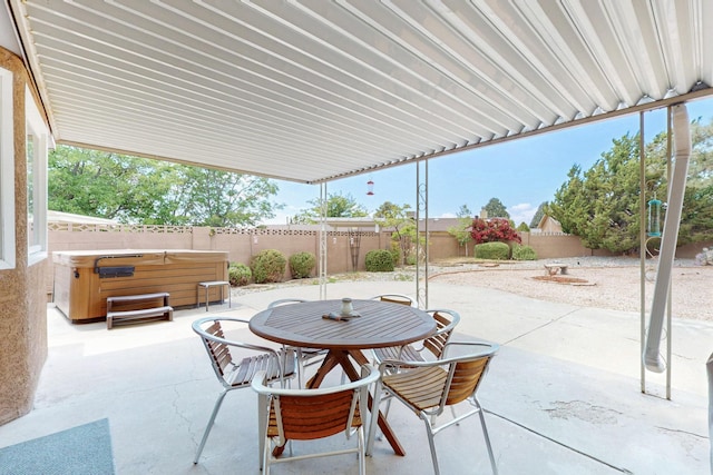 7313 Valley Forge Rd NE, Albuquerque, NM 87109 - fenced backyard with a hot tub, a patio area, and outdoor dining space