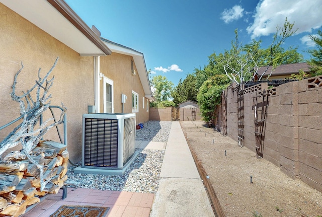 7313 Valley Forge Rd NE, Albuquerque, NM 87109 - view of home's exterior with central AC unit, stucco siding, and a fenced backyard