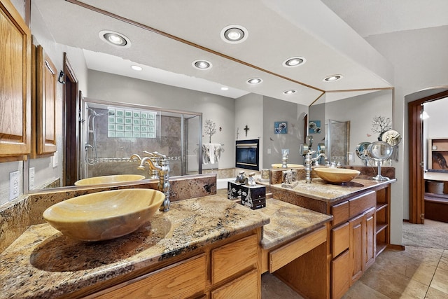 3039 Ashkirk Loop SE, Rio Rancho, NM 87124 - full bathroom featuring a shower stall, double vanity, recessed lighting, and tile patterned flooring