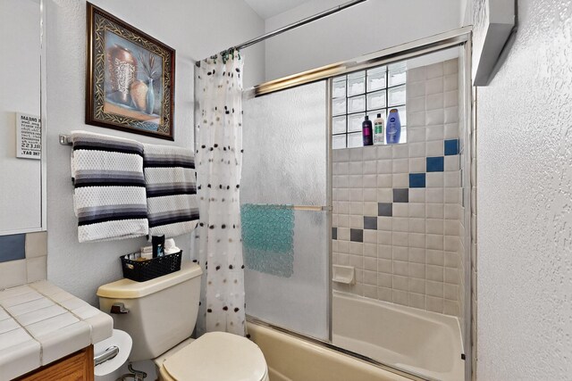 3039 Ashkirk Loop SE, Rio Rancho, NM 87124 - full bathroom with shower / bath combination with glass door, toilet, a textured wall, and vanity