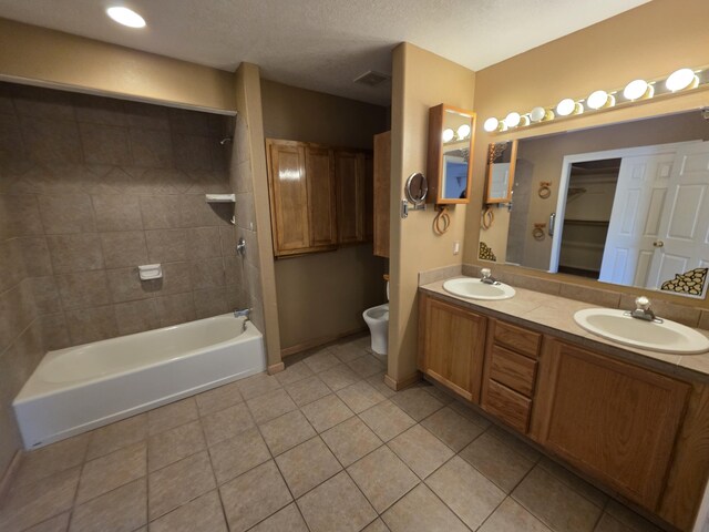 8 Revelations Pl SW, Los Lunas, NM 87031 - bathroom with tile patterned floors, double vanity, and tub / shower combination