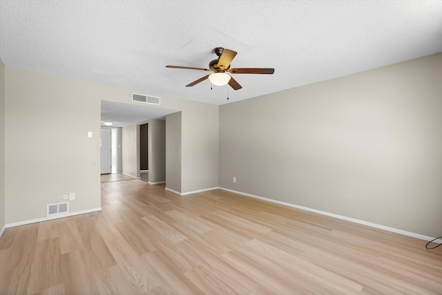 3901 La Frente Ct SE, Rio Rancho, NM 87124 - unfurnished room featuring a ceiling fan, light wood-style floors, baseboards, and a textured ceiling