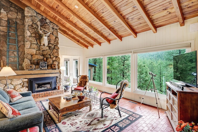 78 Slate Rd, Jemez Springs, NM 87025 - living room with wooden ceiling, brick floors, and a fireplace