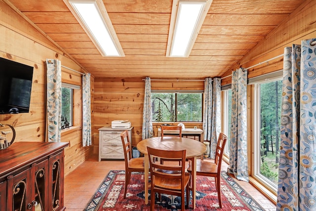 78 Slate Rd, Jemez Springs, NM 87025 - dining space featuring vaulted ceiling, wood ceiling, healthy amount of natural light, wood walls, and brick flooring