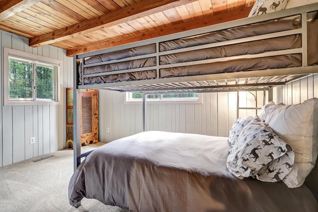 78 Slate Rd, Jemez Springs, NM 87025 - carpeted bedroom featuring wood ceiling with exposed beams and wooden walls