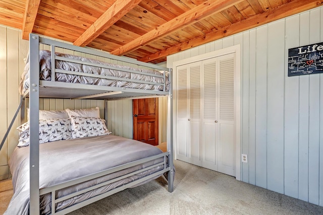 78 Slate Rd, Jemez Springs, NM 87025 - bedroom featuring carpet, wood walls, and wooden ceiling with exposed beams