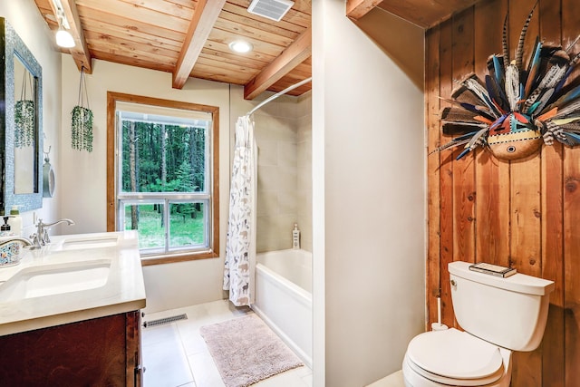 78 Slate Rd, Jemez Springs, NM 87025 - bathroom featuring wooden ceiling with exposed beams, toilet, double vanity, tile patterned flooring, and shower / bath combo with shower curtain
