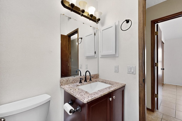 6322 Lamy St NW, Albuquerque, NM 87120 - bathroom featuring toilet, vanity, and tile patterned flooring
