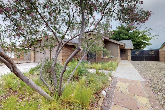 6322 Lamy St NW, Albuquerque, NM 87120 - view of property exterior with brick siding and a garage