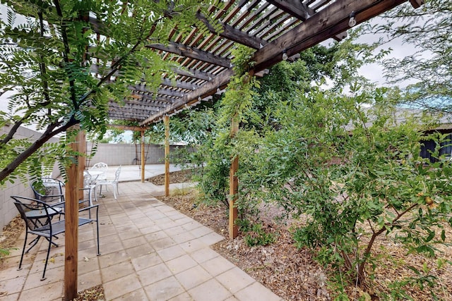 6322 Lamy St NW, Albuquerque, NM 87120 - fenced backyard with a pergola and a patio area