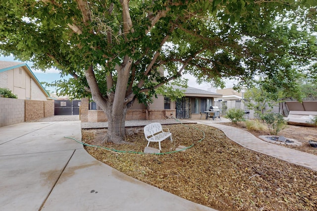 6322 Lamy St NW, Albuquerque, NM 87120 - view of front of home featuring a patio area and brick siding