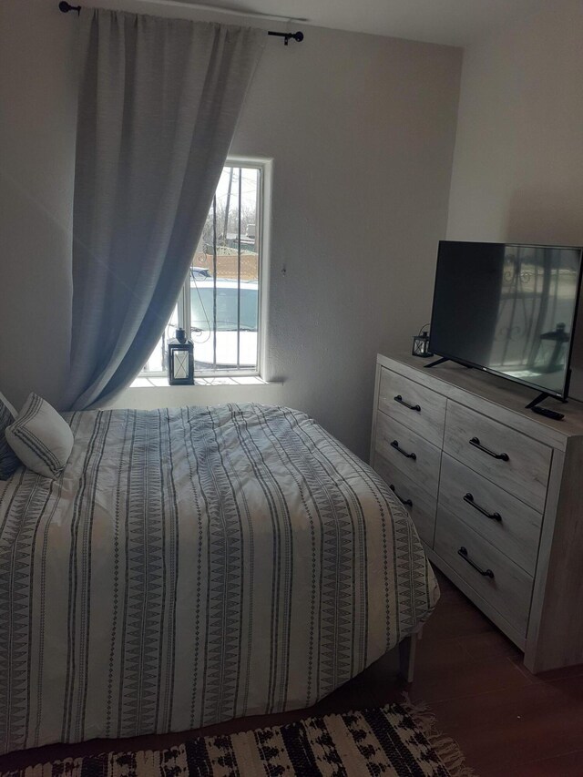 711 Lewis Ave SE, Albuquerque, NM 87102 - bedroom with wood finished floors and access to outside