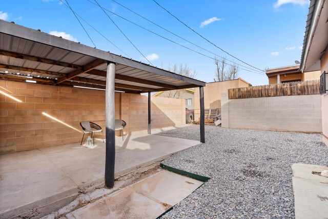 711 Lewis Ave SE, Albuquerque, NM 87102 - fenced backyard featuring a patio area