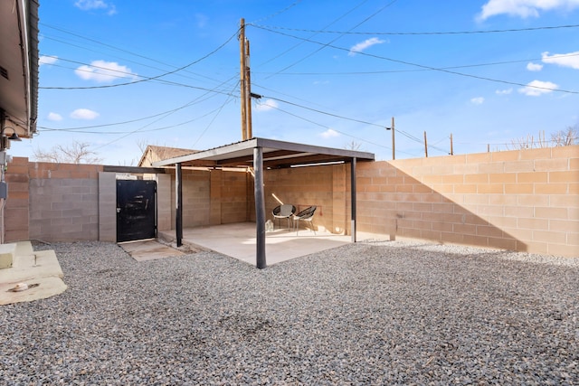 711 Lewis Ave SE, Albuquerque, NM 87102 - fenced backyard with a patio