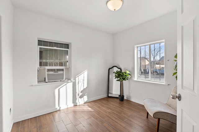 711 Lewis Ave SE, Albuquerque, NM 87102 - unfurnished room featuring baseboards, wood finished floors, and cooling unit