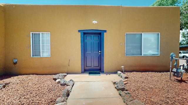 1207 Barelas Rd SW, Albuquerque, NM 87102 - view of exterior entry featuring stucco siding