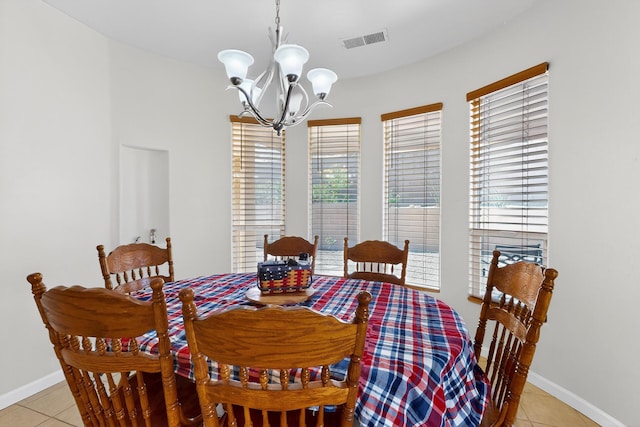 1365 Wilkes Way SE, Rio Rancho, NM 87124 - dining space with a chandelier, light tile patterned floors, and baseboards